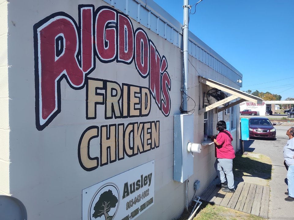 Golden fried chicken on a simple diner plate.