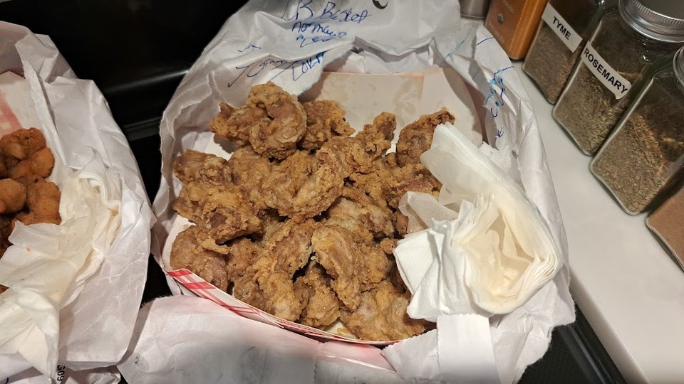 Printed menu for fried chicken and sandwiches.